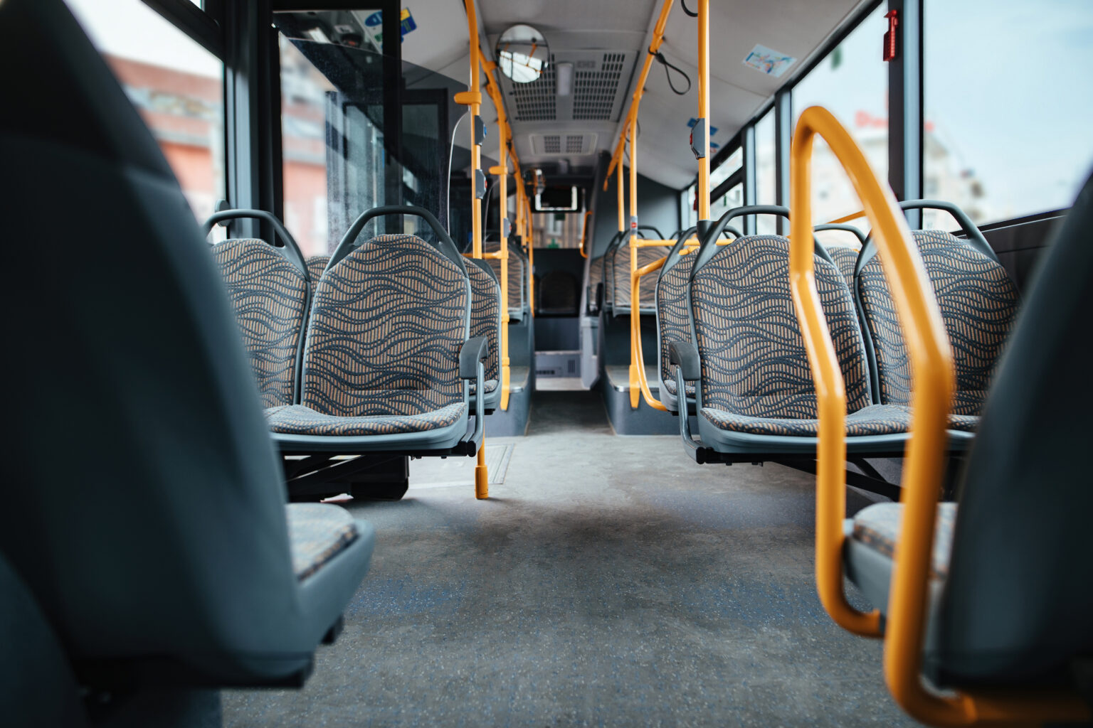 Public transit bus on a city street, representing connected 5G fleet operations